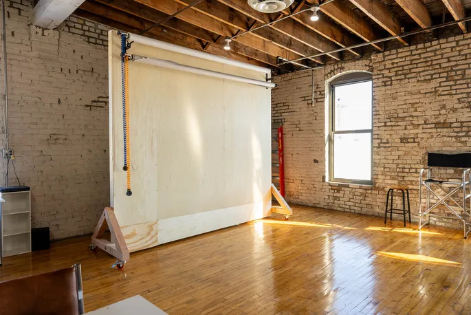 Studio lights aimed at the white cove
