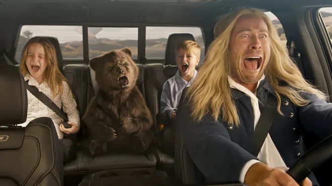 Three pickup trucks in a forest, for the Goldilocks Super Bowl commercial