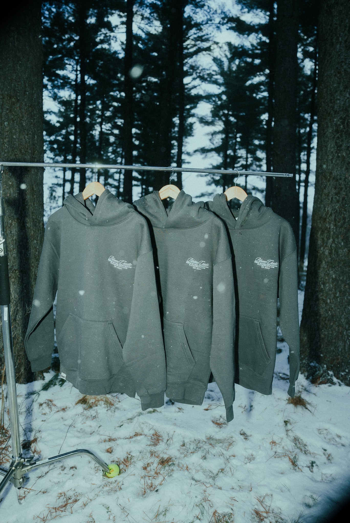 A black hoodie with the Bloom logo, from the winter merch