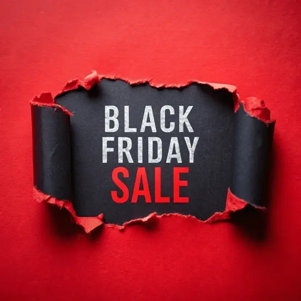 A camera, lens, and gimbal on a table, for Black Friday video production deals