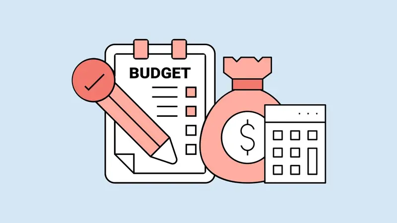 A calculator, notebook, and coffee on a desk, for video production budgets
